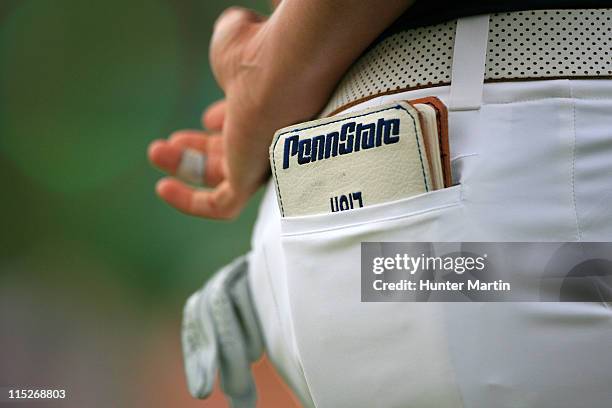 Penn State yardage book sticks out of the pocket of Katie Futcher as she stands on the 18th green during the final round of the ShopRite LPGA Classic...