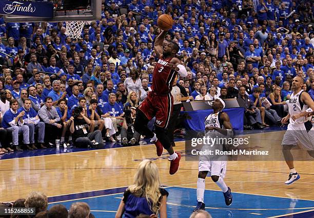 Dwyane Wade of the Miami Heat dunks against Jason Terry of the Dallas Mavericks in the first half of Game Three of the 2011 NBA Finals at American...