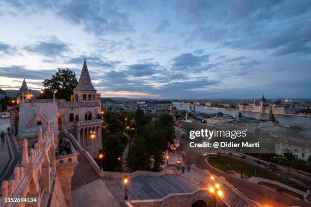 nightfall over the iconic fisherman's bastion in budapest - fishermen's bastion stock pictures, royalty-free photos & images