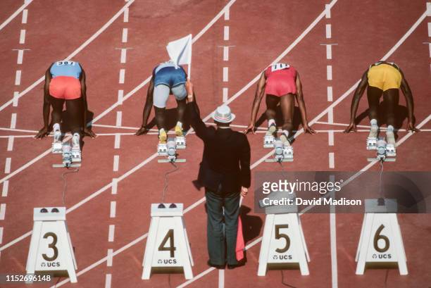 Carl Lewis of the USA and the Santa Monica Track Club prepares to run the quarter final round of the Men's 100 meter event at the 1984 United States...