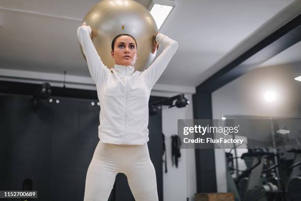 i realy love to work out with fitness ball - yoga pants stock pictures, royalty-free photos & images