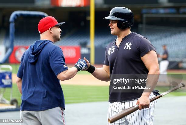 Steve Pearce of the Boston Red Sox talks with Luke Voit of the New York Yankees during batting practice at Yankee Stadium on May 30, 2019 in New York...