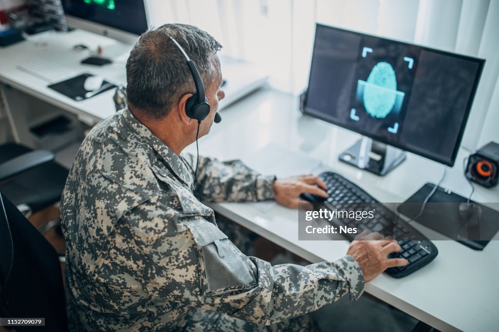 An old American soldier works in the office