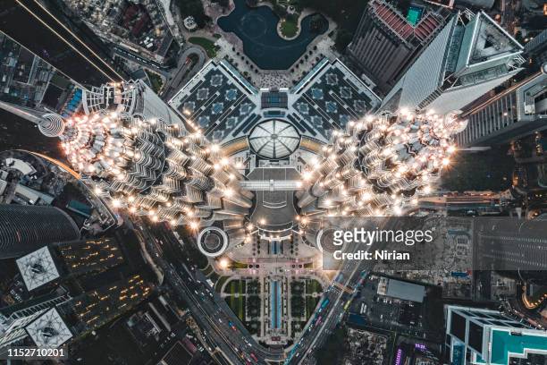 petronas twin towers view from drone - kuala lumpur stock pictures, royalty-free photos & images