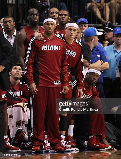 Jamaal Magloire, James Jones, Mike Bibby, Erick Dampier, Eddie House, Mike Miller and Joel Anthony of the Miami Heat look on from the bench against...