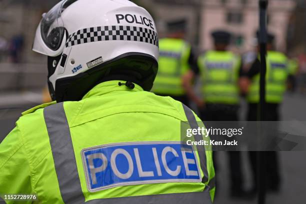 Police on duty amidst tight security surrounding the visit of Her Majesty Queen Elizabeth II to the Scottish Parliament, where she gave an address...