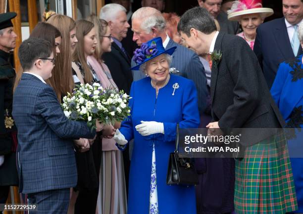 Queen Elizabeth II, accompanied by Ken Macintosh , Presiding Officer of the Scottish Parliament, meets members of Young Scot at the Scottish...