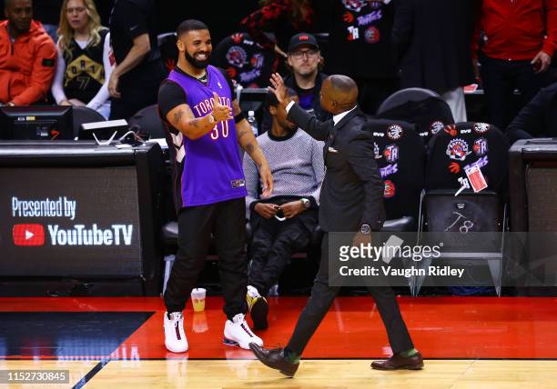 Rapper Drake is seen wearing a Dell Curry jersey before Game One of the 2019 NBA Finals between the Golden State Warriors and the Toronto Raptors at...