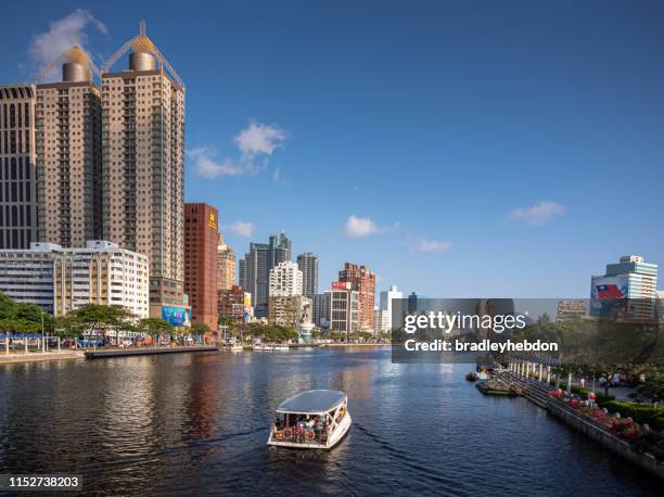 boat taking tourists for a cruise down the love river in kaohsiung city, taiwan - kaohsiung stock pictures, royalty-free photos & images