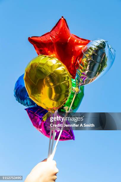 foil balloons - metallic balloons stock pictures, royalty-free photos & images