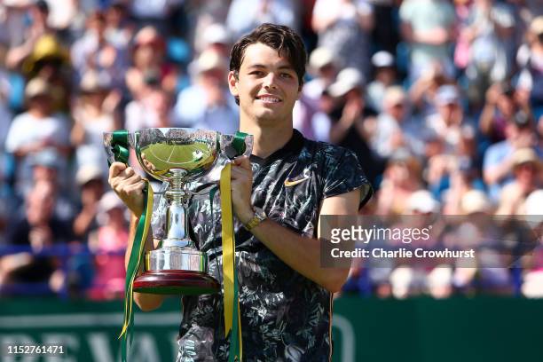 Taylor Fritz of USA celebrates with the cup after winning the men's singles final against Sam Querrey of USA during day six of the Nature Valley...