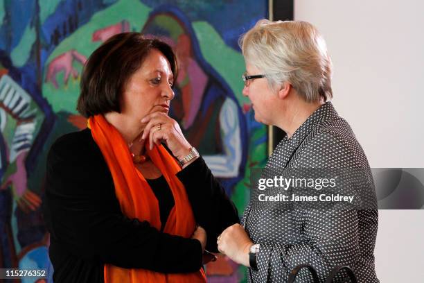 Justice Minister Sabine Leutheusser-Schnarrenberger talks to Education Minister Annette Schavan during the weekly German government cabinet meeting...