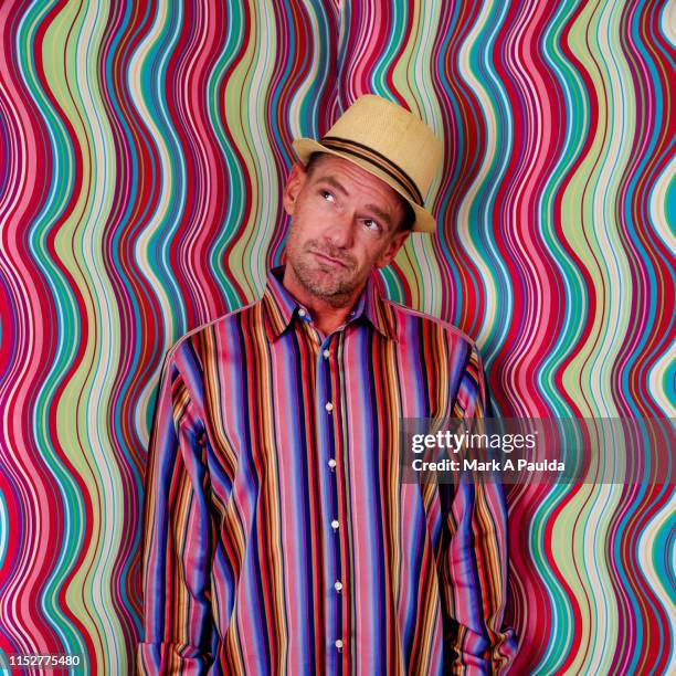 male tilting his head and looking up - multi coloured shirt stock pictures, royalty-free photos & images