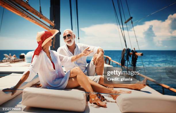 senior couple on a sailing cruise. - rich sailing imagens e fotografias de stock