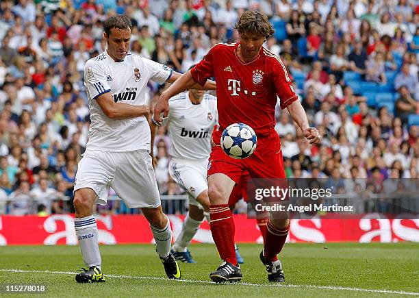 Ivan Helguera of Real Madrid duels for the ball with Michael Tarnat of Bayern Muenchen during the Corazon Classic Match between Allstars Real Madrid...