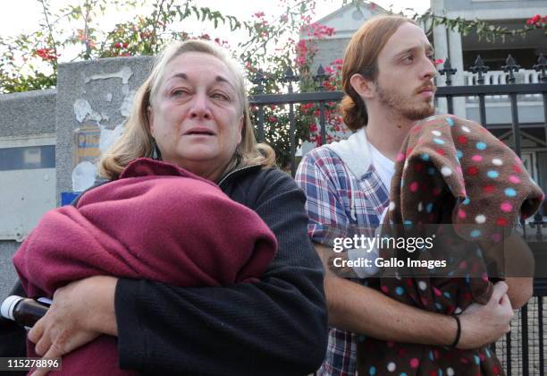 Jenny Berger and Dean Berger carry babies outside the Building Blocks temporary foster home on June 3, 2011 in Cape Town, South Africa. Seven babies...