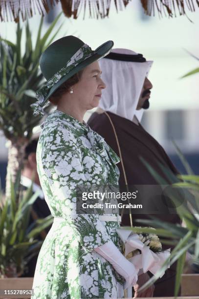 Queen Elizabeth ll andKhalifa bin Hamad bin Abdullah bin Jassim bin Muhammed Al Thani, the Emir of Qatar stand as national anthems are played to...