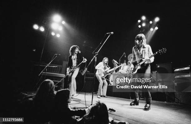 English hard rock supergroup Bad Company performing live, circa 1973; they are Paul Rodgers, Raymond Burrell, Simon Kirke, and Mick Ralphs.