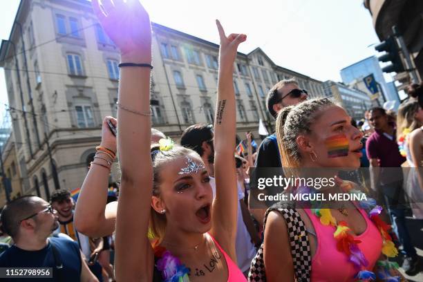 People parade during the Milan Pride 2019 on June 29, 2019 in Milan, as part of the LGBT Pride month marking the 50th anniversary of the New York...