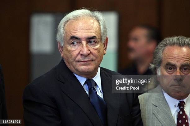 Former head of the International Monetary Fund Dominique Strauss-Kahn appears at an arraignment trial for sexual assault with his lawyer Benjamin...