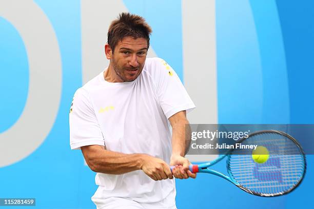 Jan Hajek of the Czech Republic plays a shot during his Men's Singles first round match against Marsel Ilhan of Turkey on day one of the AEGON...