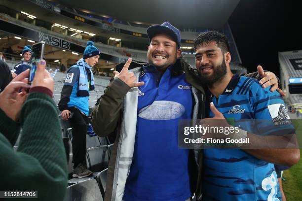 Akira Ioane of the Blues with fans during the round 16 Super Rugby match between the Blues and the Bulls at Eden Park on May 31, 2019 in Auckland,...