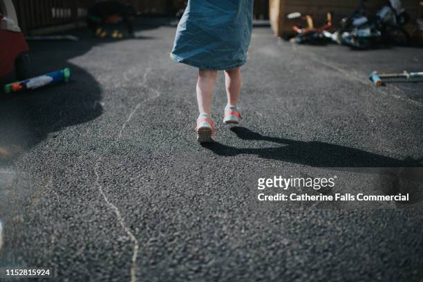 little girl skipping - little feet stock pictures, royalty-free photos & images