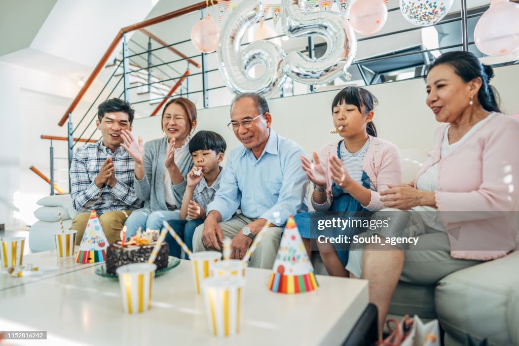 Family celebrating grandfather's birthday together
