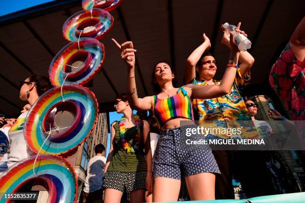 People parade during the Milan Pride 2019 on June 29, 2019 in Milan, as part of the LGBT Pride month marking the 50th anniversary of the New York...