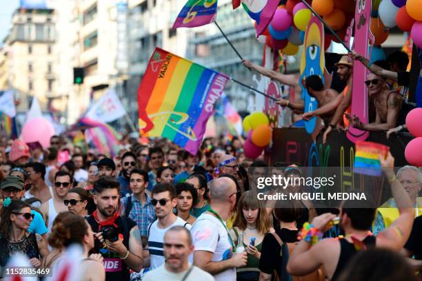 People parade during the Milan Pride 2019 on June 29, 2019 in Milan, as part of the LGBT Pride month marking the 50th anniversary of the New York...