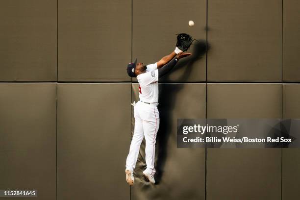 Jackie Bradley Jr. #19 of the Boston Red Sox attempts to catch a fly ball during the fifth inning of game one of the 2019 Major League Baseball...