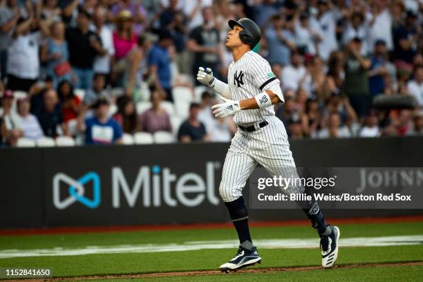 Aaron Judge of the New York Yankees reacts after hitting a home run during the sixth inning of game one of the 2019 Major League Baseball London...