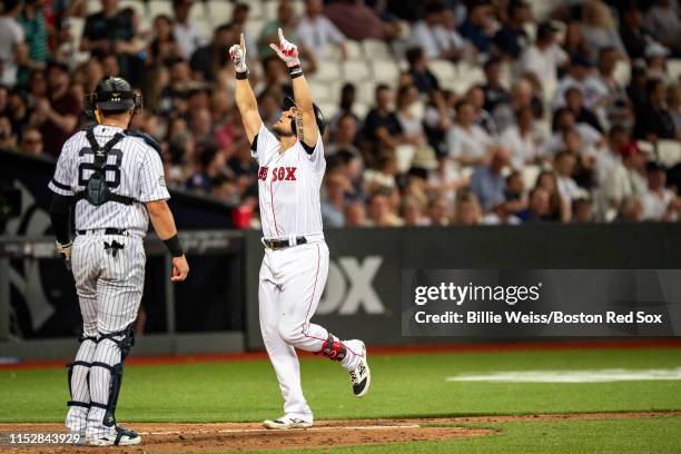 Michael Chavis of the Boston Red Sox reacts after hitting a home run during the seventh inning of game one of the 2019 Major League Baseball London...