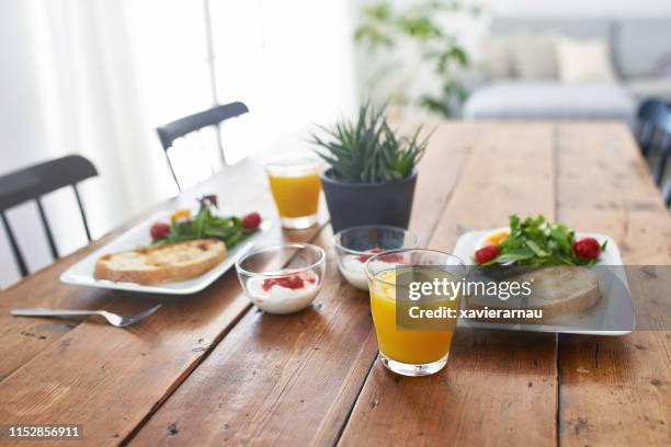 close-up of fresh breakfast served on wooden table - breakfast no people stock pictures, royalty-free photos & images