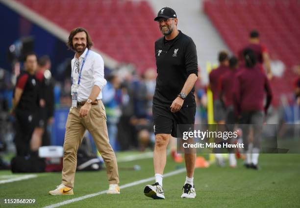 Jurgen Klopp, Manager of Liverpool speaks to Andrea Pirlo during the Liverpool FC training session on the eve of the UEFA Champions League Final...