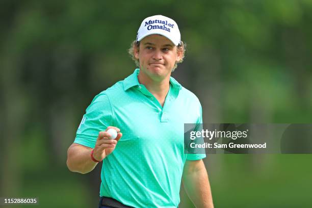 Bud Cauley waves to the gallery after making a putt during the second round of The Memorial Tournament Presented by Nationwide at Muirfield Village...