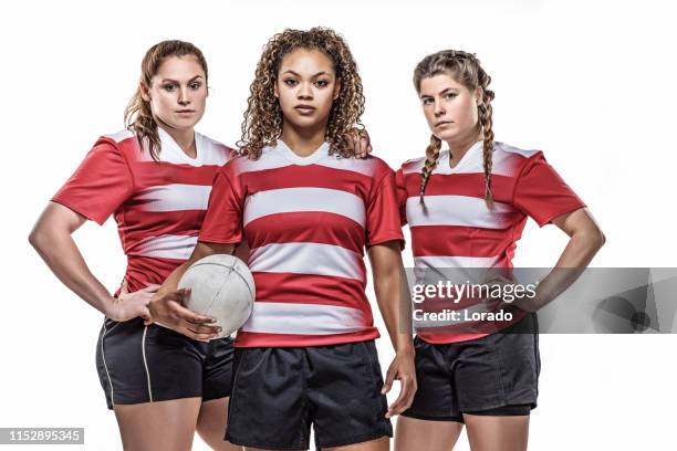 three female rugby players studio - female rugby team stock pictures, royalty-free photos & images