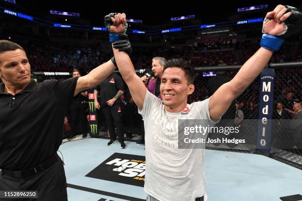 Joseph Benavidez celebrates after defeating Jussier Formiga of Brazil in their flyweight bout during the UFC Fight Night event at the Target Center...