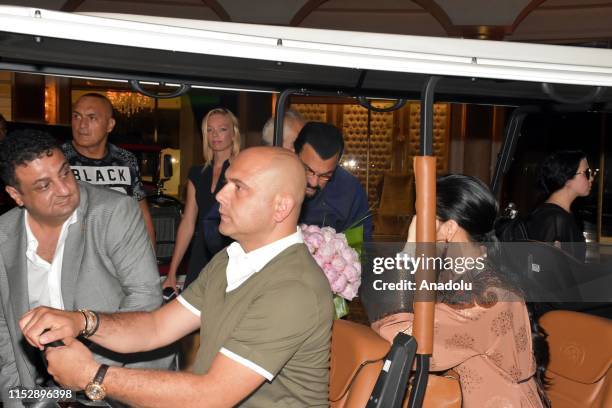 Hollywood actor Steven Seagal and his wife Erdenetuya Seagal are on their way to a private village by a caddie cart following their arrival on an...