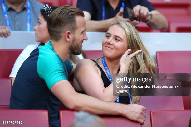 Harry Kane of Tottenham Hotspur speaks to his fiance Katie Goodland during the Tottenham Hotspur training session on the eve of the UEFA Champions...