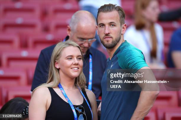 Harry Kane of Tottenham Hotspur speaks to his fiance Katie Goodland during the Tottenham Hotspur training session on the eve of the UEFA Champions...