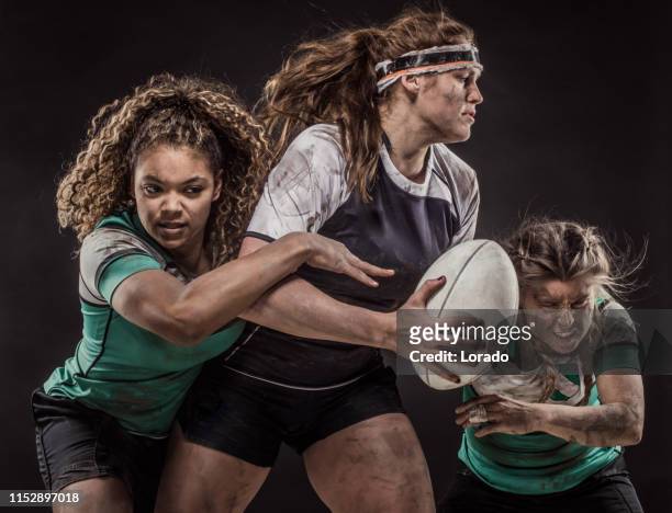 three dirty female rugby players - rugby union stock pictures, royalty-free photos & images