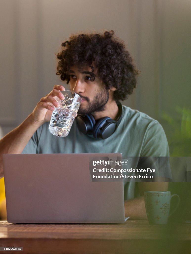 Creative businessman using laptop in office