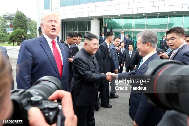 Handout photo provided by Dong-A Ilbo of North Korean leader Kim Jong Un, U.S. President Donald Trump, and South Korean President Moon Jae-in inside...