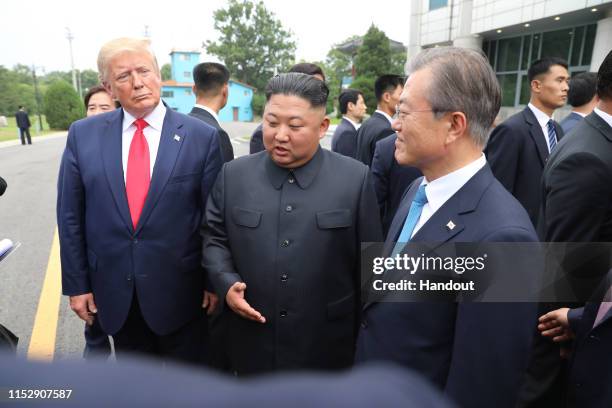 Handout photo provided by Dong-A Ilbo of North Korean leader Kim Jong Un, U.S. President Donald Trump, and South Korean President Moon Jae-in inside...