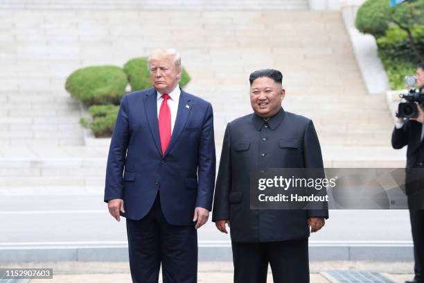 Handout photo provided by Dong-A Ilbo of North Korean leader Kim Jong Un and U.S. President Donald Trump inside the demilitarized zone separating the...