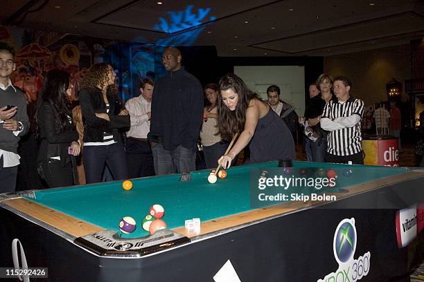 Khloe Kardashian and NBA player Shaquille O'Neal challenge each other with a game of pool at the 2008 NBA All-Star Shaquille O'Neal and Reggie Bush...