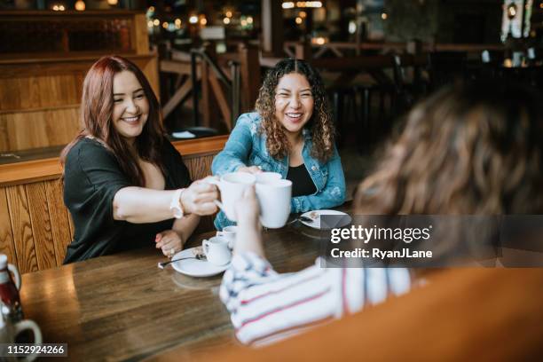 group of latina friends out for brunch - tacoma stock pictures, royalty-free photos & images