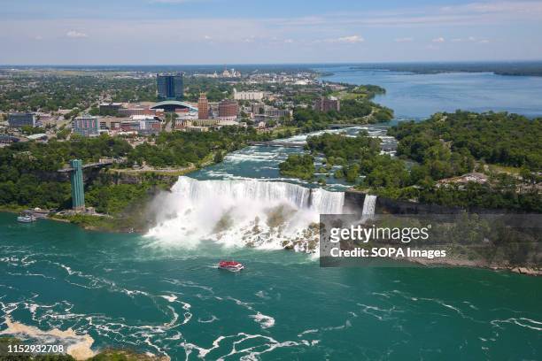 Aerial view of American Falls and Bridal Veil Falls of the Niagara Falls are seen on a hot and sunny day. Niagara Falls is the collective name for...