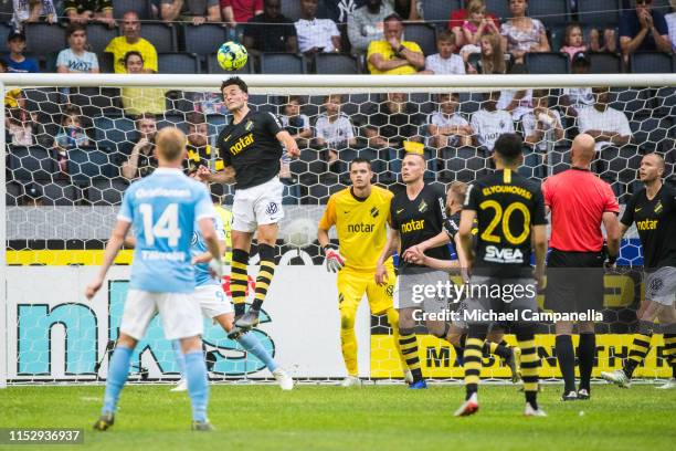 Daniel Granli of AIK heads the ball during an Allsvenskan match between AIK and Malmö FF at Friends Arena on June 30, 2019 in Stockholm, Sweden.